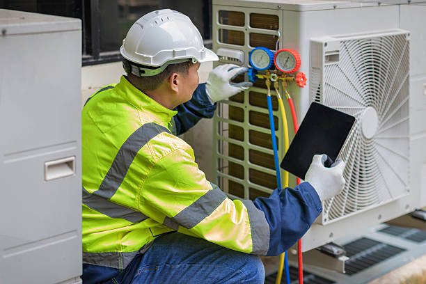 Professional Heat Pump Repair technician working in Tumacacori, AZ